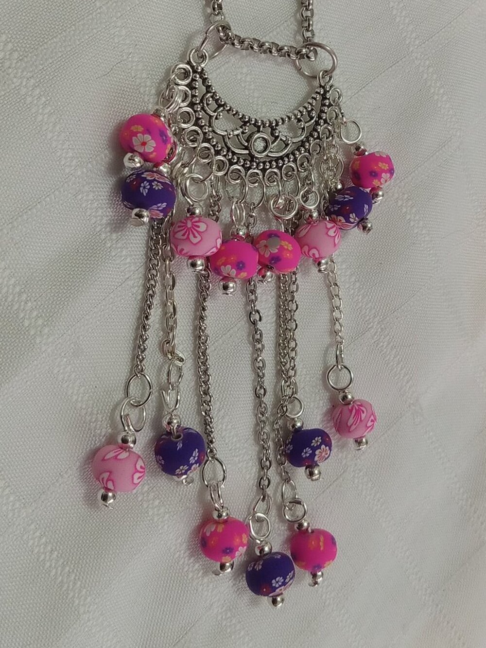 Exquisite handmade necklace featuring a half-moon-shaped Tibetan silver charm